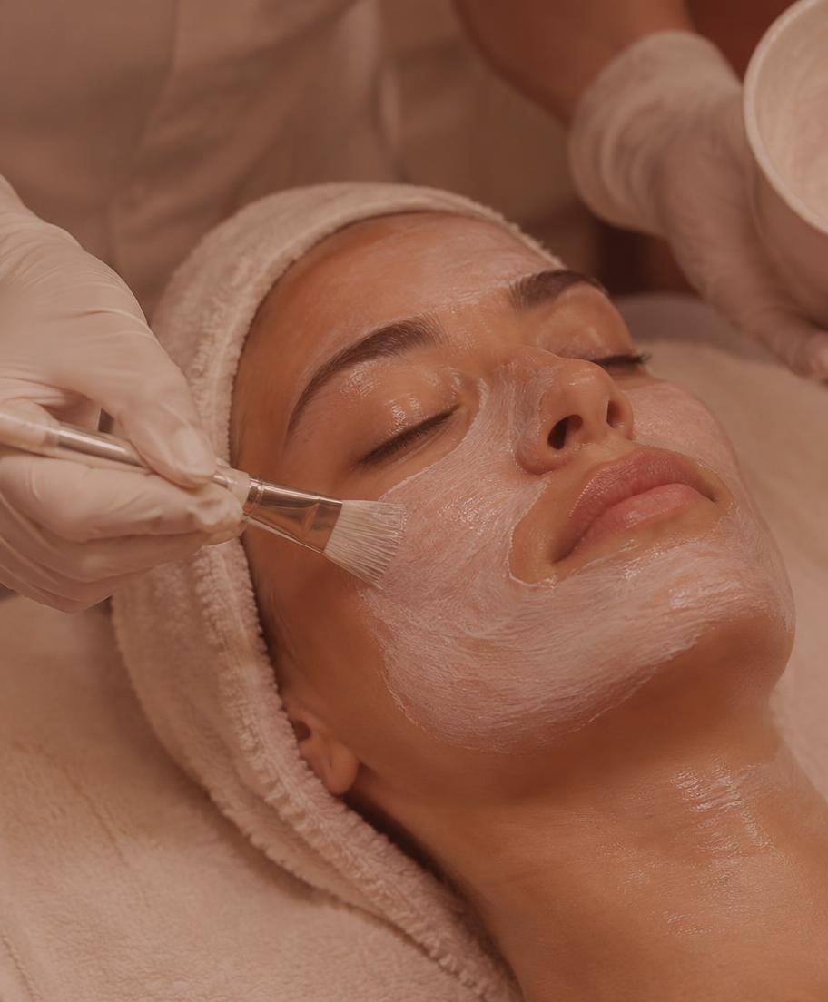 Esthetician applying a facial mask in Surrey BC